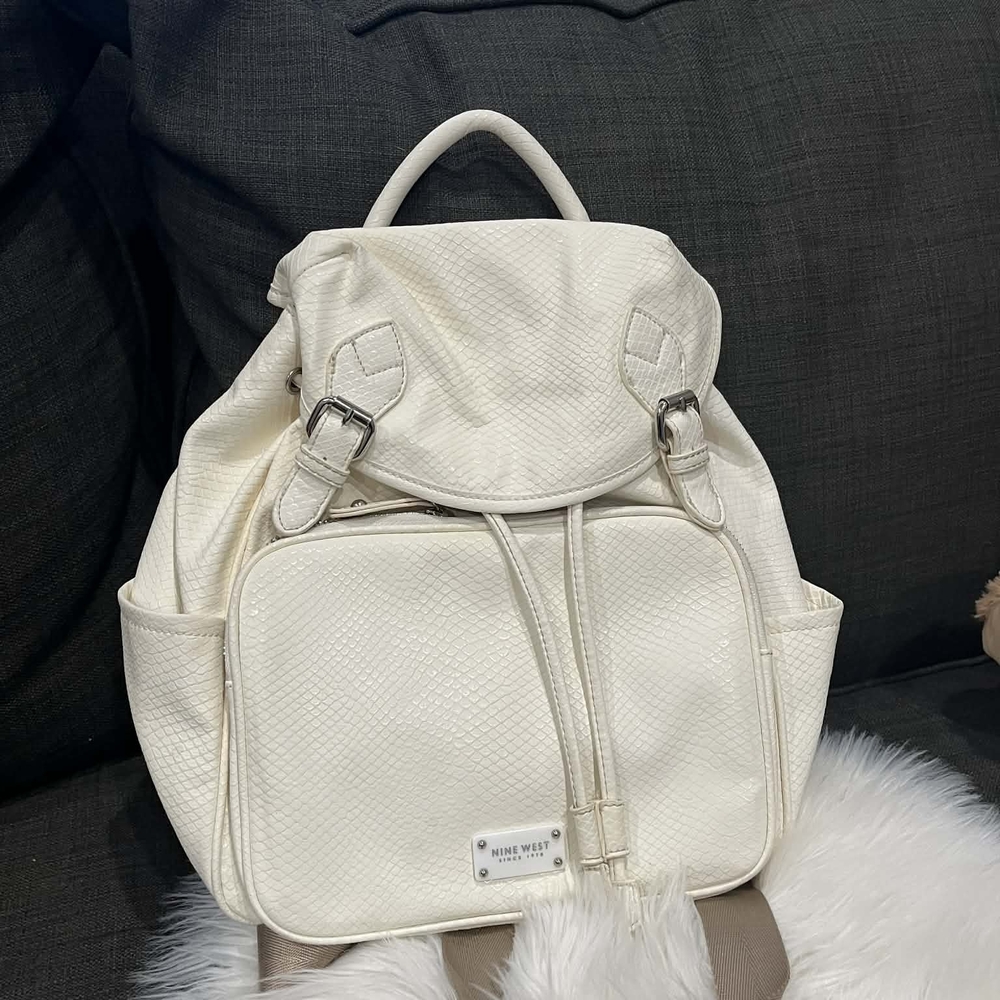 Nine West Ivory Textured Backpack It has a small stain on the back.